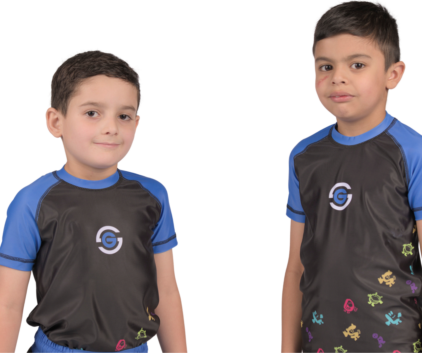 two kids wearing junior uk no gi solid grappling blue rashguard and shorts